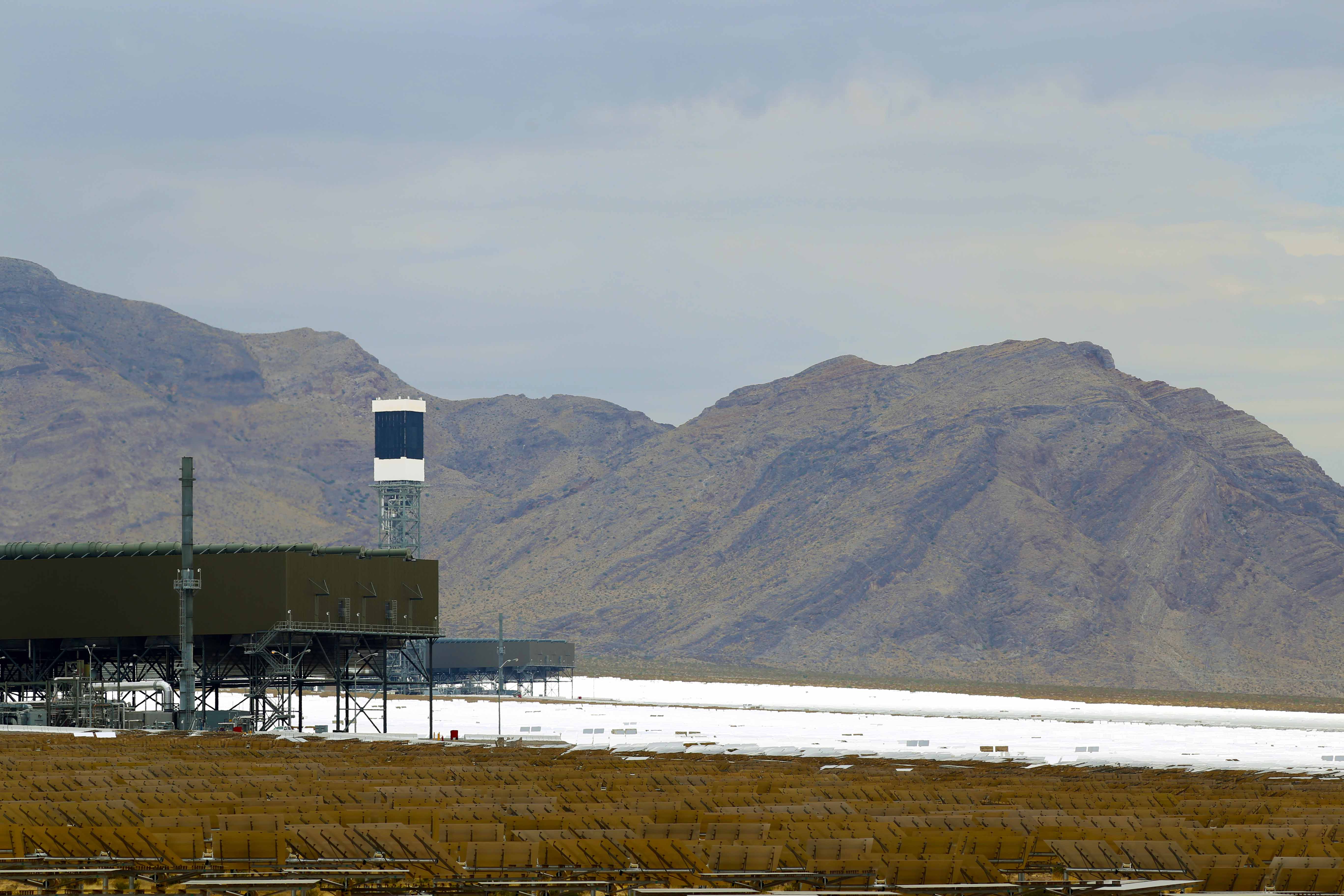 Northernmost Ivanpah generating tower, surrounded by partly sunlit mirrors.
